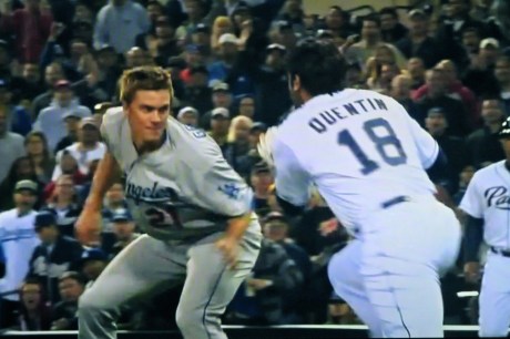 Dodger pitcher Zach Greinke stands his ground against charging Padre Carlos Quentin.