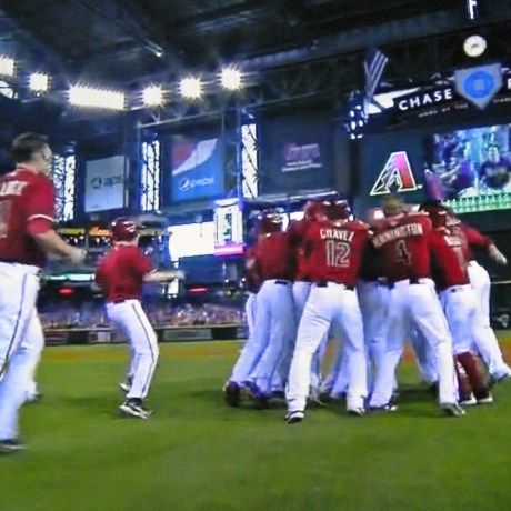 The Arizona Diamondbacks rush Paul Goldschmidt after his game-winning single.