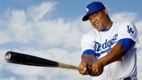 Juan Uribe usually swings at every pitch as if his family's lives depend on it.