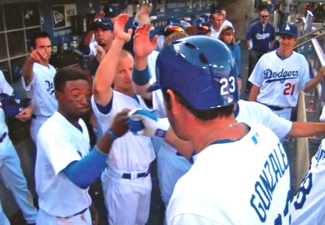 Shortstop Dee Gordon greets first baseman Adrian Gonzalez with a special ritual all their own after A-Gone's towering home run.