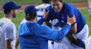 Catcher A.J. Ellis is hoisted aloft by right-fielder Yasiel Puig after hitting the walk-off RBI single that made fans forget Puig's ninth-inning blunder.