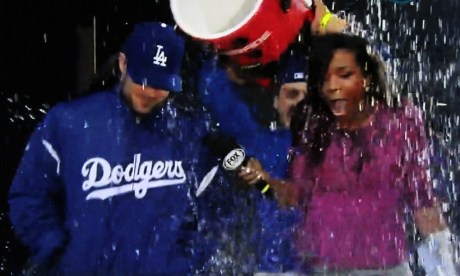 Pinch runner Skip Shumaker got wet with Kristina Pink after scoring the winning run on a walk-off wild pitch.