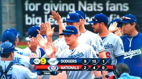 The Dodgers congratulate each other after sweeping the Nationals on Sunday.