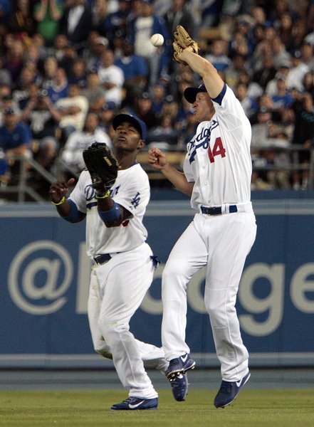 Yasiel Puig surprises Mark Ellis from behind as Ellis bobbles the ball and the Yankees score two.