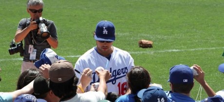 Outfielder Andre Ethier signs balls for people at Camelback Ranch in 2012.