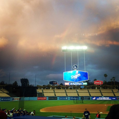 A rainbow breaks out Wednesday in the distance behind center field.