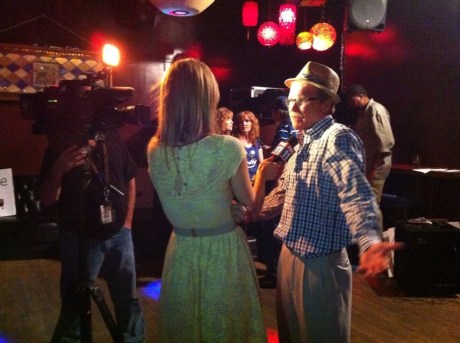 Rally host Chris Erskine vents to Fox reporter Olga Ospina at the Short Stop on Wednesday night.