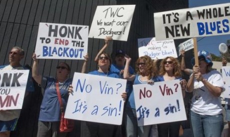 That's me with the "Honk to End the Blackout" sign. / Photo by Miguel Vasconcellos, L.A. Register
