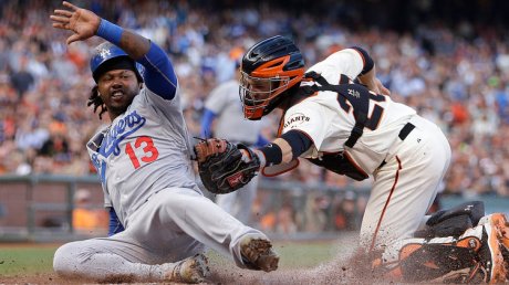 Hanley Ramirez barely beats tag by Buster Posey in 4-3 win for the Blue Crew.