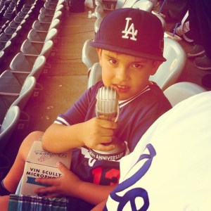 Young fan with his Vin Scully Anniversary Microphone.